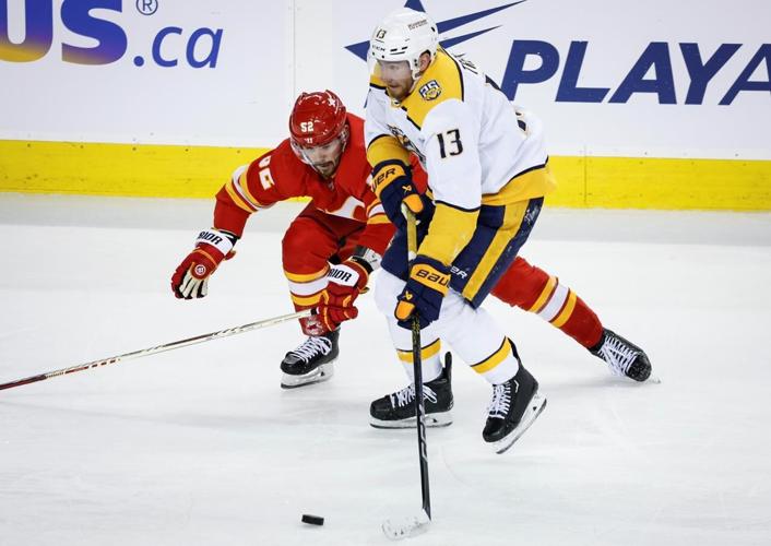 Flames rally with three goals in third to beat Predators 4-2
