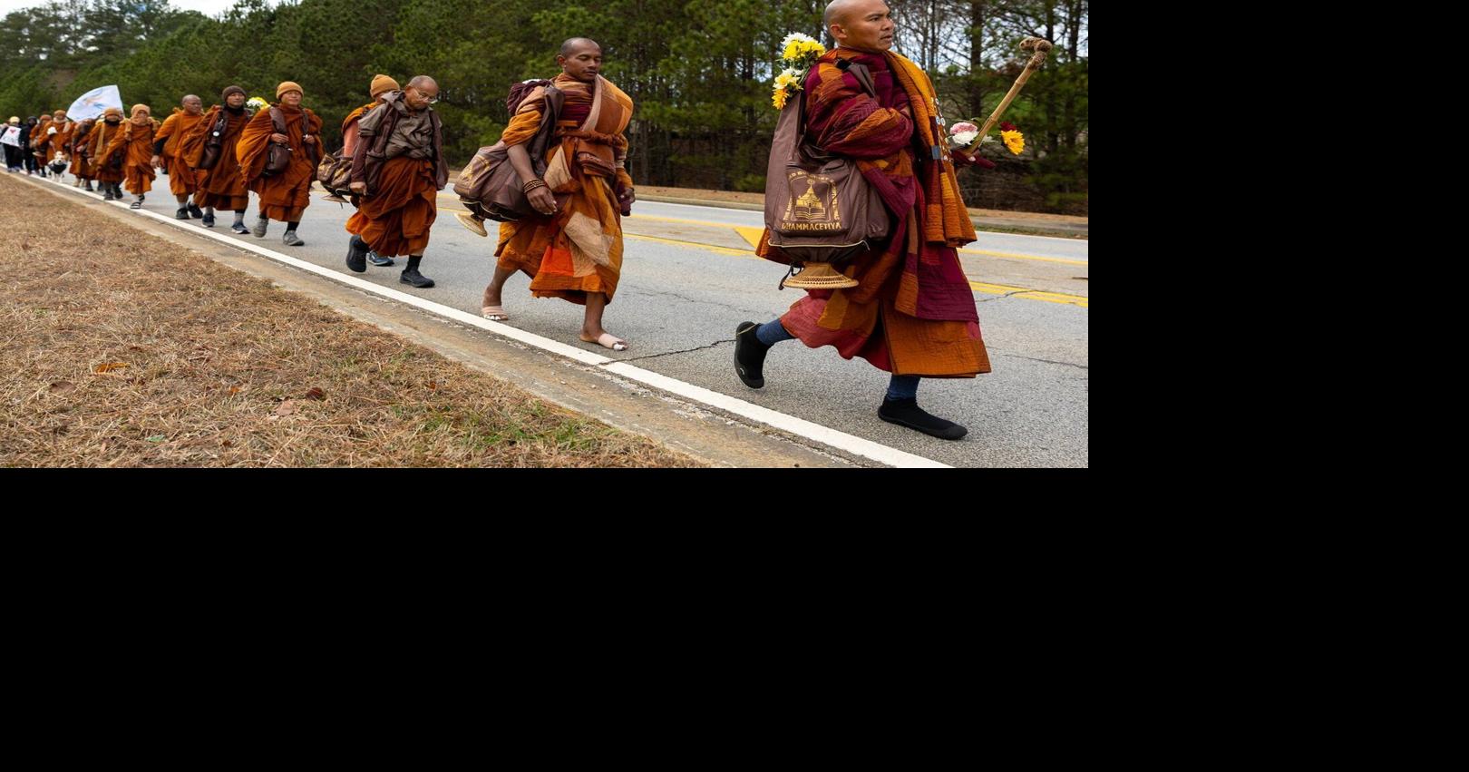 Buddhist monks persist in peace walk despite injuries as thousands follow them on social media