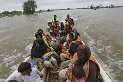 Over 120,000 evacuated from central Pakistan as floods leave survivors in scorching heat