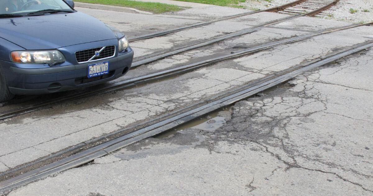 Bumpy Rails The Fixer: Bumpy rail crossing a train wreck for cars