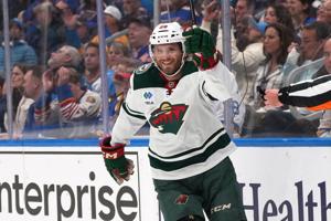 Hartman scores twice, Gustavsson makes 27 saves in Wild's 5-0 win over Blues in opener