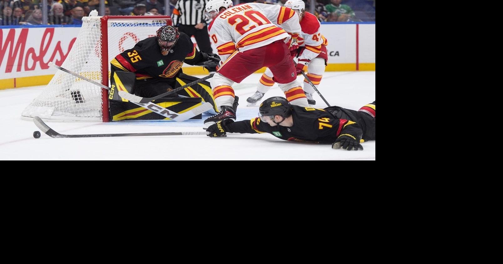 Chytil scores two, Vancouver Canucks dump Calgary Flames 5-1 in season opener