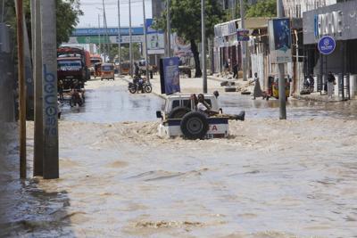 At least seven people die as heavy rains leave waist-high floodwaters in Somalia's capital