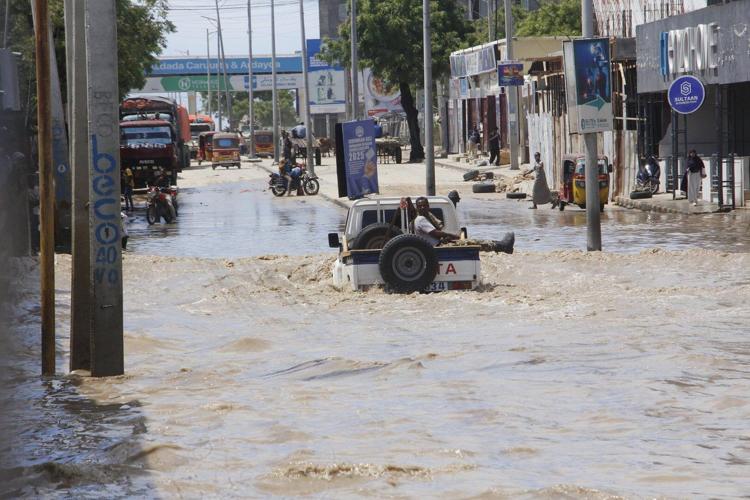 At least seven people die as heavy rains leave waist-high floodwaters in Somalia's capital