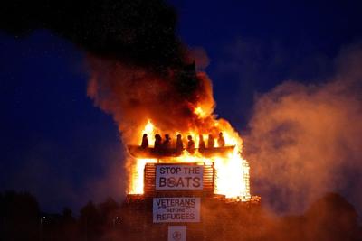 Burning of migrant boat effigy in Northern Ireland triggers police investigation