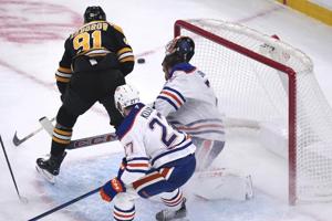 Oilers' goalie Stuart Skinner leaves game after collision with Bruins' Nikita Zadorov
