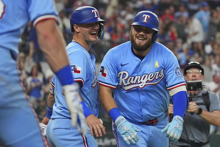 Burger and Jung get to Valdez as Rangers beat Astros 4-2 to keep pace in AL wild card