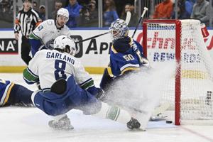 Garland scores twice to help Canucks beat the Blues 5-2