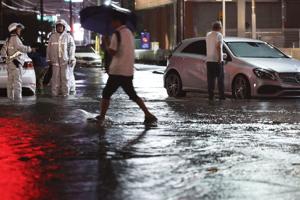 Heavy rain causes flooding near Tokyo that kills 4 and strands travelers