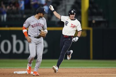 Rangers outlast AL West-leading Astros 4-3 in 12 innings to move closer to playoff spot