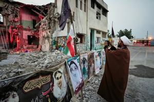 Families grieve in the ruins of an Iranian school where a US strike killed dozens of children