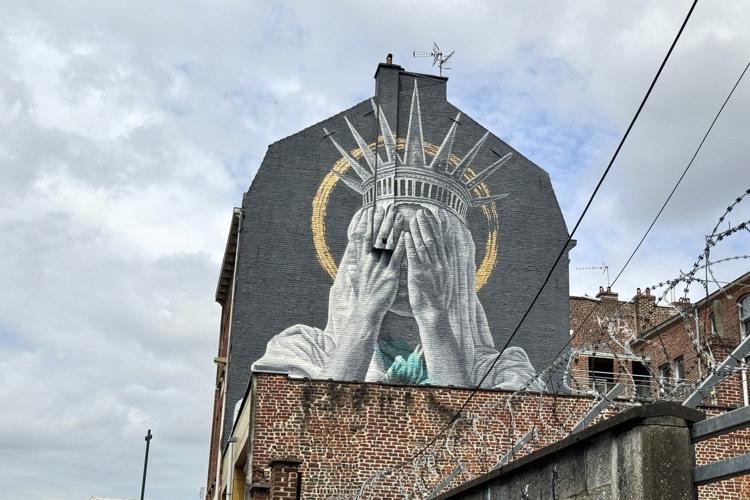 A new mural in France shows the Statue of Liberty covering her eyes in a swipe at Trump