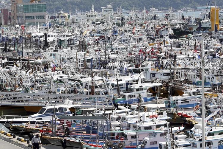 China, Japan ground ferries, flights as typhoon approaches