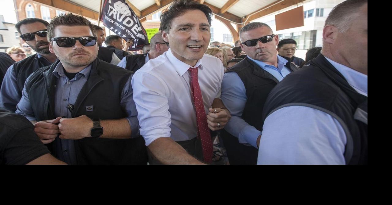 Justin Trudeau cuts appearance in Belleville short as protesters swarm motorcade