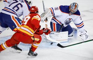 Malone scores in OT as Oilers rally to beat Flames 2-1