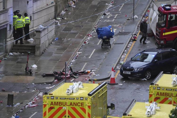 AP PHOTOS: Driver arrested after car plows into celebrating Liverpool fans