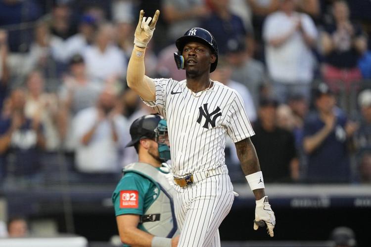 Chisholm homers twice and Schlittler wins MLB debut as Yankees top Mariners 9-6