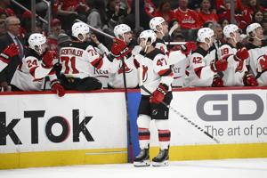 Cotter scores 2 goals to lift Devils over Capitals 5-3