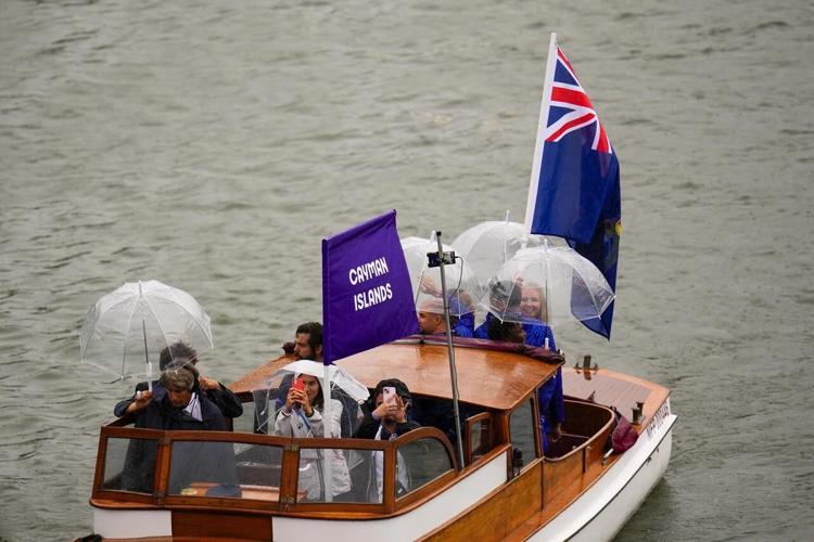 For Olympic athletes soaked by rain at the opening ceremony, getting