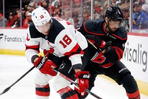 Jarvis, new arrival Miller help Hurricanes beat Devils 6-3 in season opener