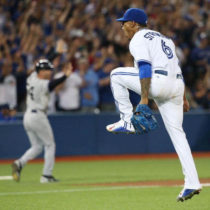 Troy Tulowitzki worked on his pitching mechanics during Blue Jays photo day