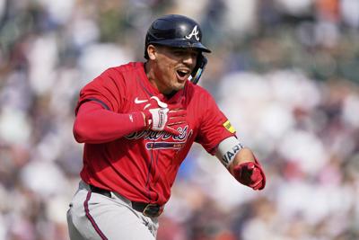 Surging Braves rally past reeling Tigers