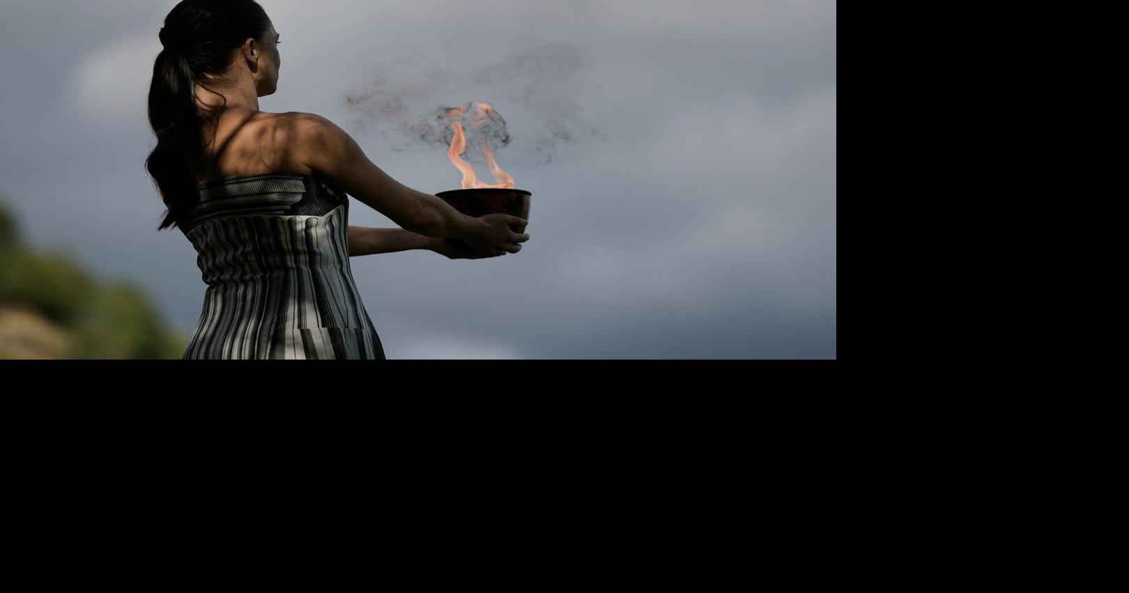 Under a cloud, the Olympic flame begins its journey to the Milan Cortina Winter Olympics