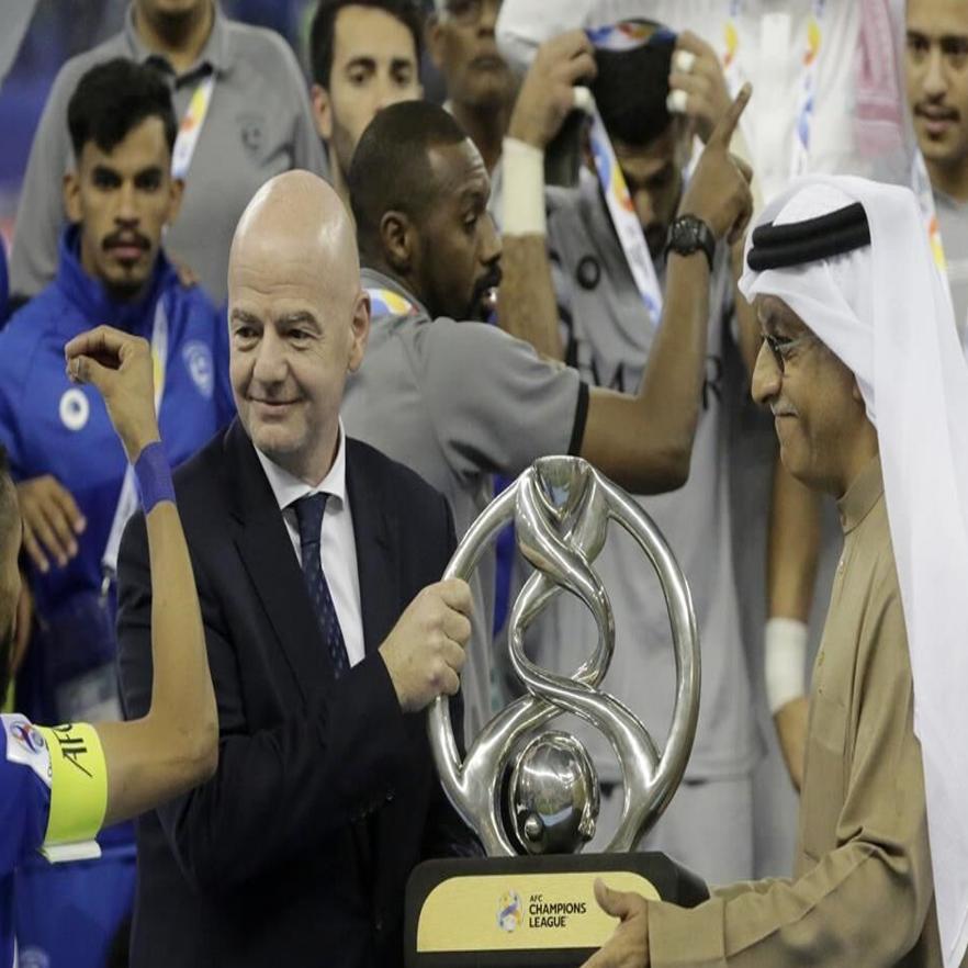 Saudi Arabia's Al Hilal soccer team players celebrate their trophy of the  AFC Champions League 2021 after the team beats South Korea's Pohang  Steelers 2-0 during their final soccermatch at the King