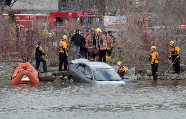 Woman dies after car plunges into Credit River