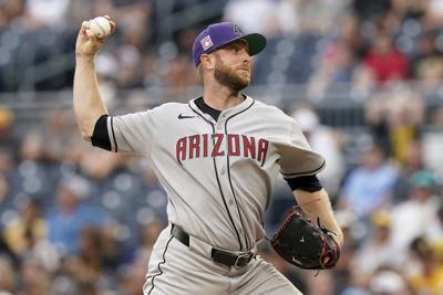 Rangers add veteran right-hander Merrill Kelly in a trade with the Diamondbacks