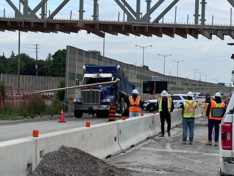 QEW reopens after dump truck strikes overpass