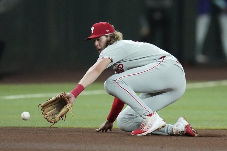 Bohm has 3 RBIs in return, Buehler good in relief as Phillies win 8-2, hurting D-backs playoff hopes