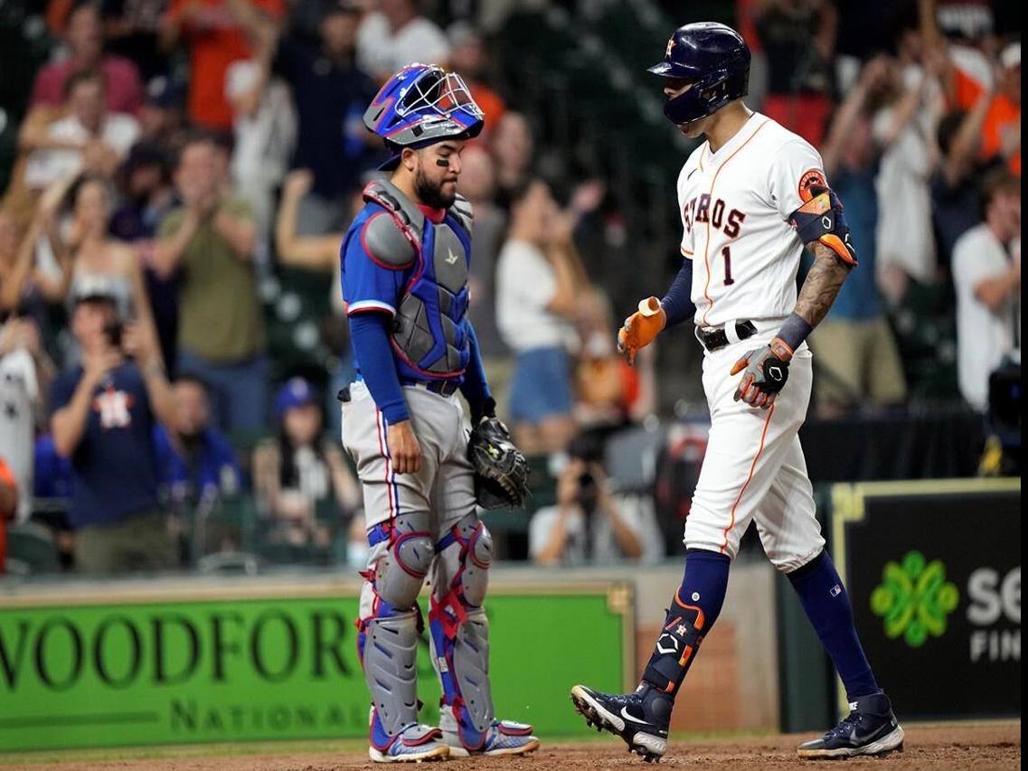 Houston Astros shortstop Carlos Correa hoists the World Series