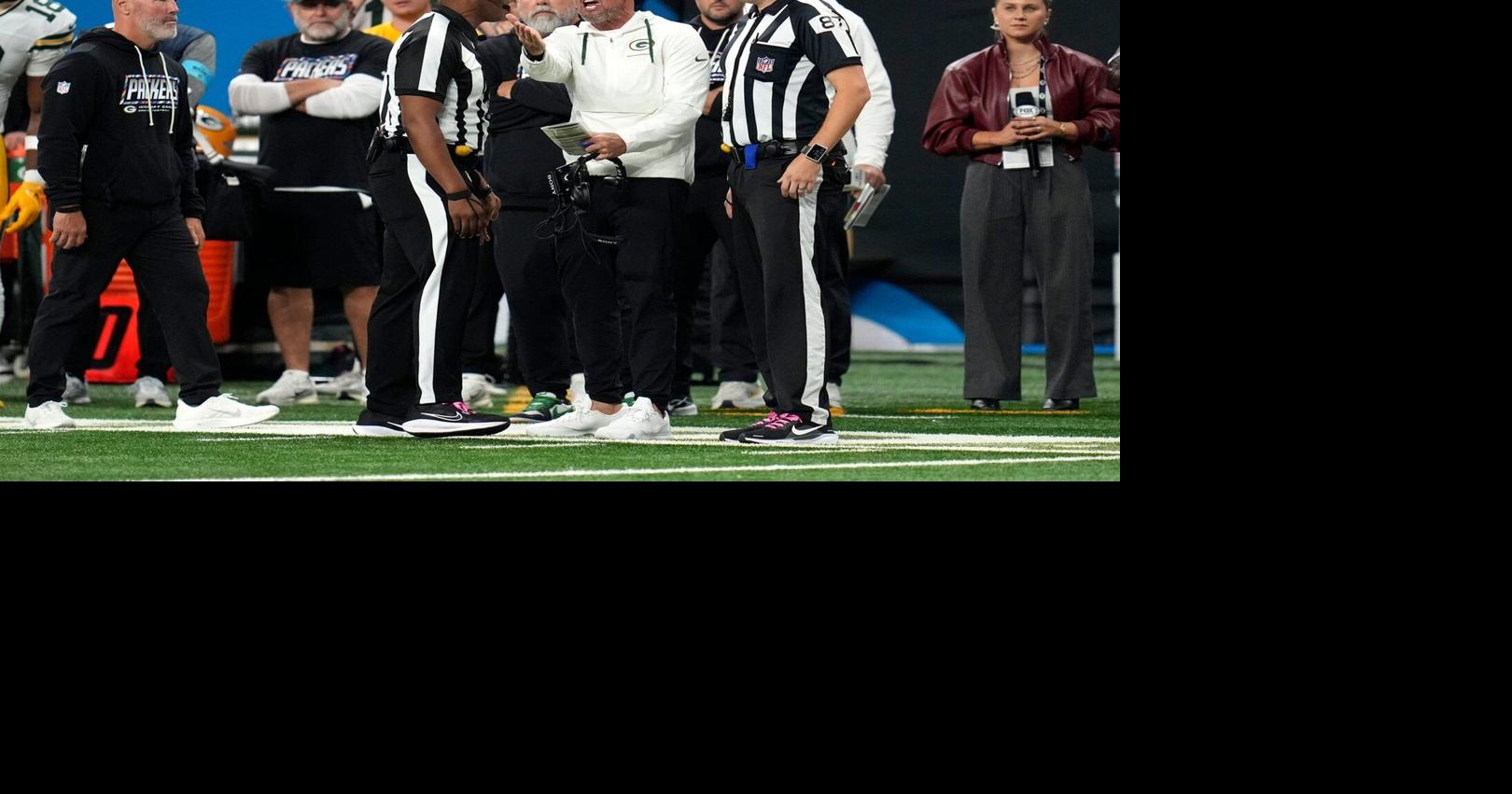 A flag-filled afternoon: Packers-Lions showdown overshadowed by rash of ...