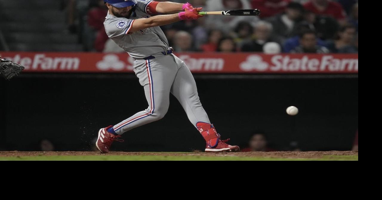 Rangers score four runs in ninth to beat Angels 9-8