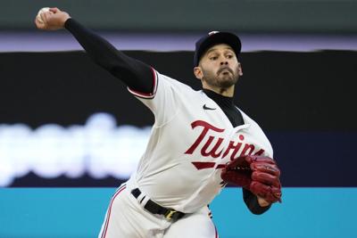 Tigers throw it away, wild toss in 9th gives Twins wild win