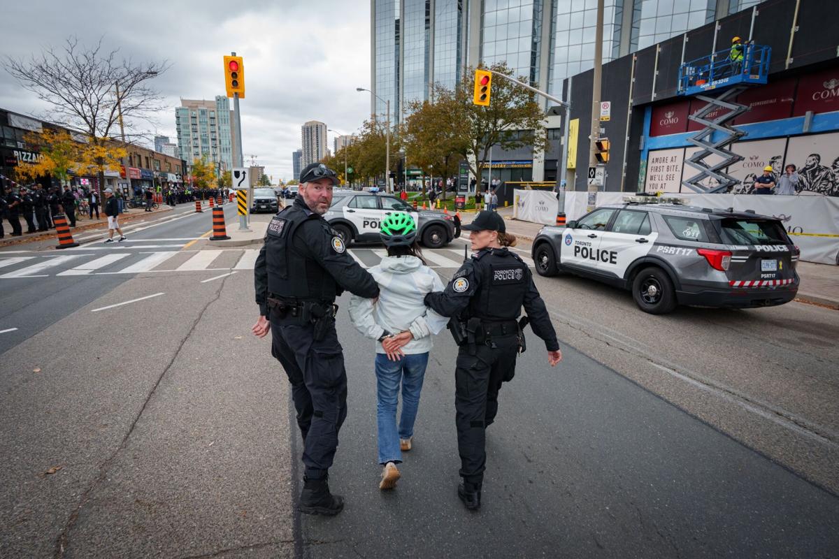 Toronto police arrest protester over lane removal protest