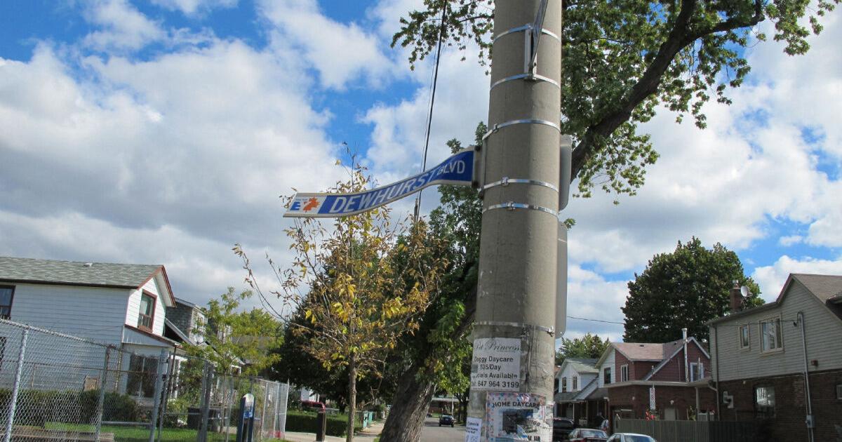 The Fixer: Mangled street sign points the wrong way