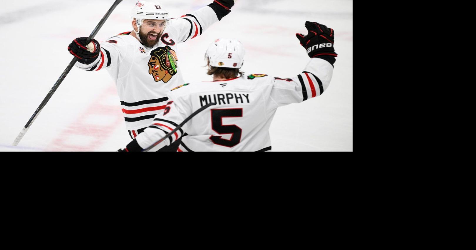 Moore and Murphy help the Blackhawks beat the Blues 7-3 for their 4th straight win
