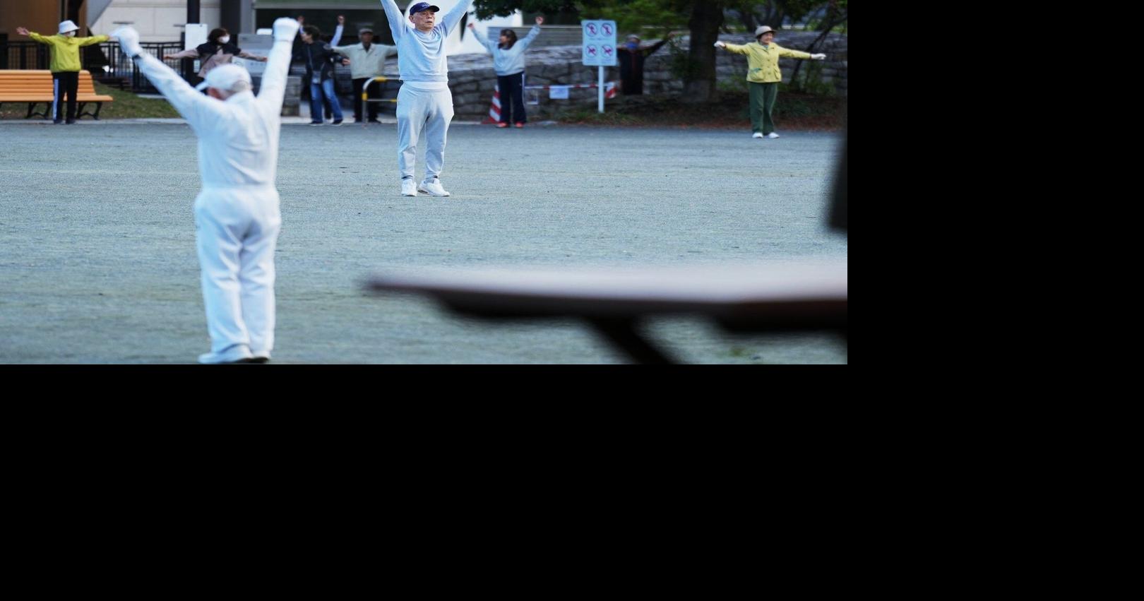 Japan awakens to Radio Taiso exercise tradition. One face of the country's longevity