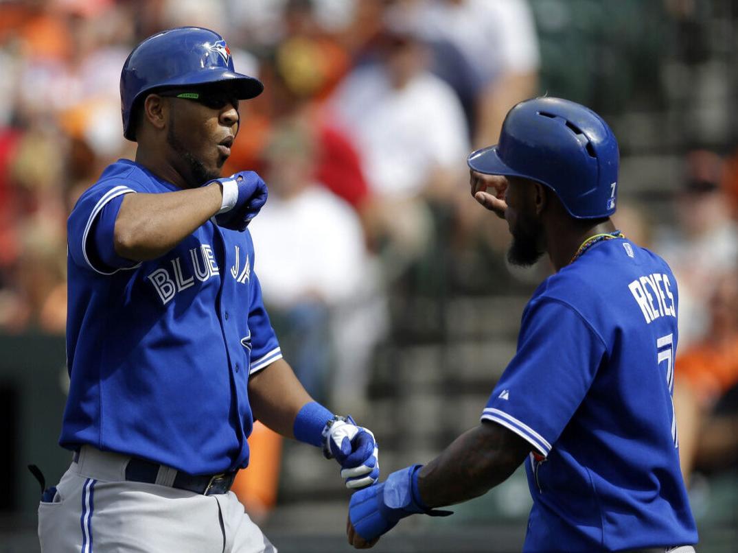 Toronto Blue Jays' Edwin Encarnacion hits a broken bat pop-out