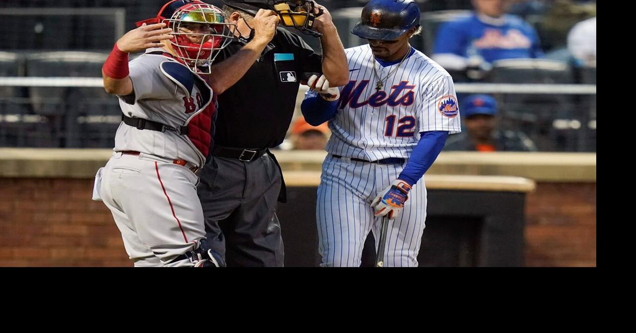 Plate ump Layne hit in mask by foul ball, leaves game