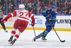 DeBrincat scores in OT, Detroit Red Wings edge Vancouver Canucks 3-2