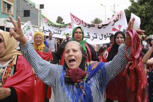 Tunisians stage anti-migrant protest as the number of stranded in transit to Europe grows
