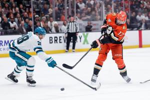 John Carlson's 1st hat trick in a 17-year career sends Ducks past Sharks 6-1, snaps 6-game skid