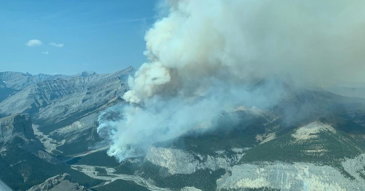 Officials hopeful cooler, wet weather will slow wildfire north of Banff ...