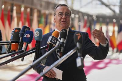 German defense minister says draft could return if volunteer numbers fall short
