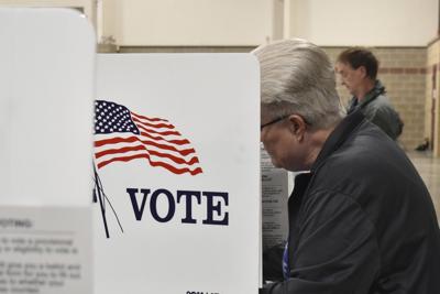 Judge limits a small part of a court order blocking Trump's election overhaul as lawsuits continue