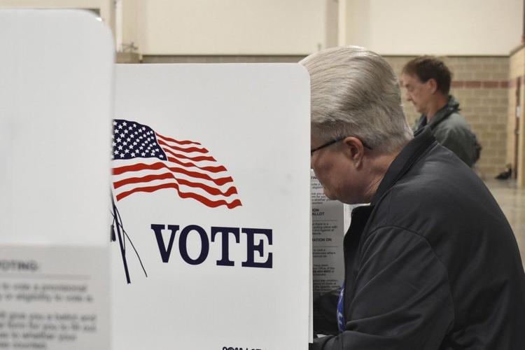 Judge limits a small part of a court order blocking Trump's election overhaul as lawsuits continue
