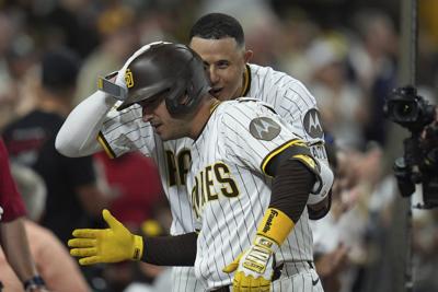 Padres clinch playoff berth with 11th-inning win over Brewers